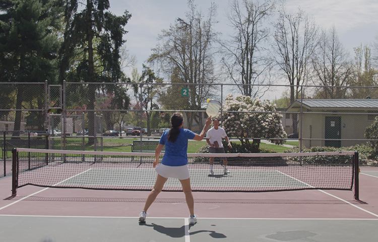 Retired couple on a tennis court